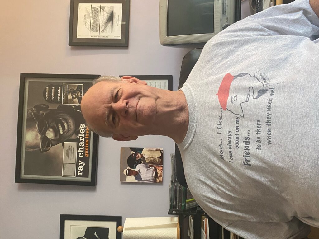 Mike Vaccaro wearing a Rheuben Allen T-shirt